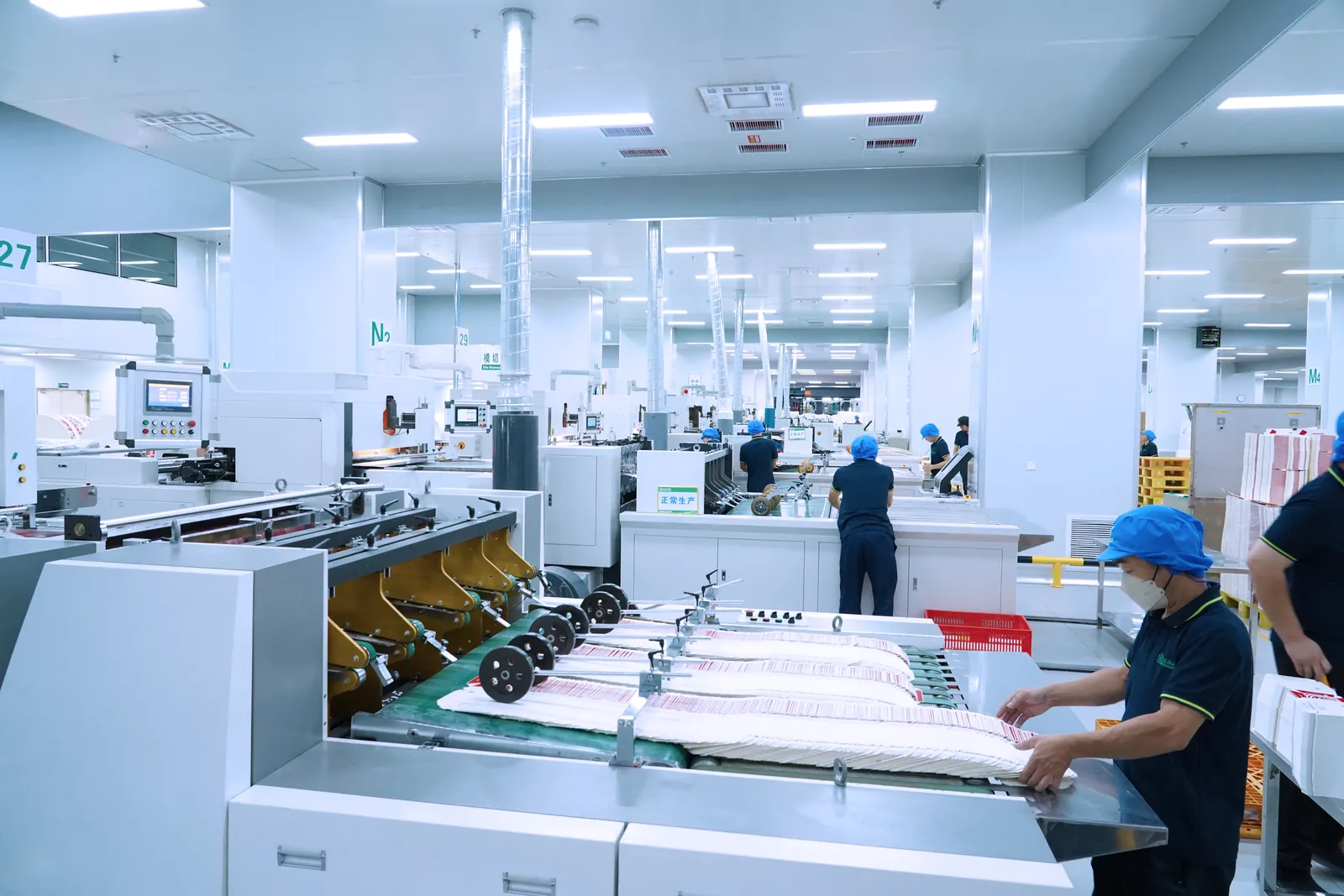 IBODY QC staff inspecting bags on the production line